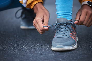 Image showing Woman, hands or shoelace tie in fitness training, exercise or start cardio workout, wellness or athlete sports. Zoom, laces or running shoes for runner on road, city street or outdoor marathon