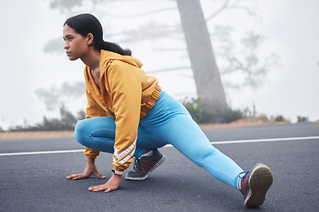 Image showing Outdoor fitness leg stretching, woman and runner exercise on a road in the mountains with focus. Workout warm up, running training and wellness of a young female ready for sports and marathon run