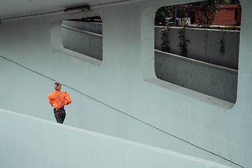 Image showing Women in sports clothes running in a modern urban environment. The concept of a sporty and healthy lifestyle