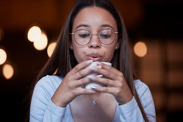 Image showing Cafe, coffee and woman blow on warm tea cup, hot chocolate or espresso drink in retail shop, store or restaurant. Commerce service, relax and young thirsty person blowing cool air on latte beverage