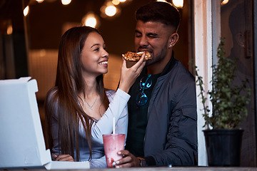 Image showing Pizza, restaurant and happy couple feeding fast food on playful romantic date for Valentines Day, bonding and quality time together. Hungry, love and fun eating girlfriend and boyfriend at shop store