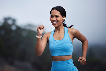 Image showing Running, fitness and happy woman in nature with cardio training, exercise goals or fast challenge for progress. Sports, morning fog and runner or young person jogging and listening to music outdoor