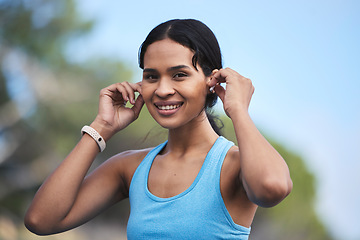 Image showing Fitness, woman and portrait smile with earphones for running, exercise or cardio workout in nature. Happy fit female runner smiling and listening to music on earpieces for audio track and exercising