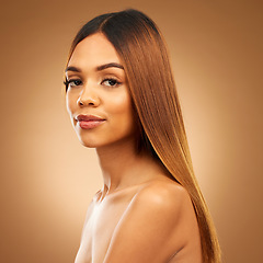 Image showing Beauty, hair care and portrait of serious woman in studio for growth, color shine or healthy texture. Aesthetic female model for haircare, natural makeup and hairdresser or salon on brown background