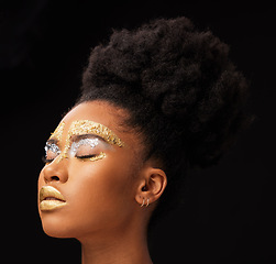 Image showing Beauty, gold and glow with black woman and makeup in studio for luxury, cosmetics or African pride. Natural, creative and goddess with female model on background for queen, bronze and glamour