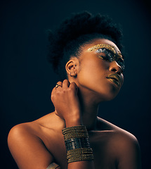 Image showing Beauty, gold and jewelry with black woman and makeup in studio for luxury, cosmetics and African pride. Natural, creative and goddess with female model on background for queen, bronze and glamour