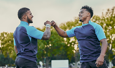 Image showing Sport, athlete men and fist bump on field for rugby teamwork, winning and success at game. Team building, happiness and support for sports friends, goals and winner to celebrate achievement together