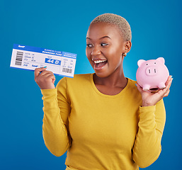 Image showing Piggy bank, travel ticket and black woman with saving on blue studio for flight, boarding passport and investment. Traveling mockup, money and excited girl for immigration, holiday or global vacation