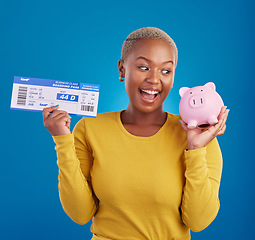 Image showing Piggy bank, travel ticket and black woman with savings in blue studio with flight, boarding passport and investment. Traveling mockup, money and girl celebrate immigration, holiday or global vacation