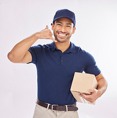 Image showing Call me, delivery man and courier with phone gesture an happy to deliver package as ecommerce in studio white background. Shipping, excited and employee or person with parcel using cellphone sign