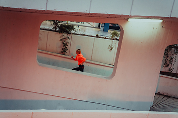 Image showing Women in sports clothes running in a modern urban environment et night time. The concept of a sporty and healthy lifestyle