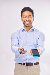 Image showing Portrait, ecommerce and glasses with a man in studio on a gray background to offer pos payment for eye care. Happy, smile with an agent marketing while holding a wireless finance device and eyewear