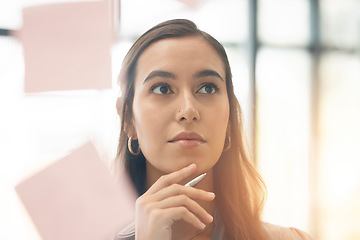 Image showing Face, office brainstorming and woman thinking of notes for research, agenda and mindmap at window. Serious female employee at glass for ideas of solution, strategy and planning vision of target goals