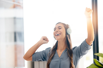 Image showing Business woman, headphones and dance in office for happiness, motivation and fun celebration of smile. Happy female employee, dancing and laughing to music for success, inspiration and excited energy