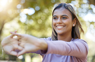 Image showing Sports, nature and woman doing a stretching workout before a workout in the park or garden. Fitness, wellness and female athlete doing arm warm up exercise before pilates training outdoor in field.