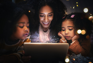 Image showing Tablet, night a woman reading to her children in a tent while camping in the bedroom of their home together. Black family, story or kids with a mother storytelling to her kids at bedtime for bonding