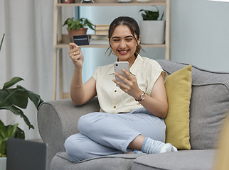 Image showing Woman, credit card and cellphone for online shopping in home with digital payment, fintech or money transfer. Happy female person, mobile banking and finance for web sales, password and financial app