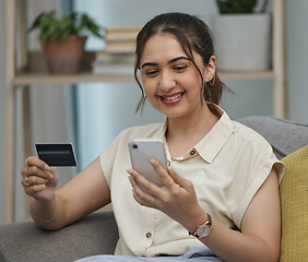 Image showing Happy woman, credit card and online shopping on smartphone in home for digital payment, fintech or money transfer. Female, mobile banking and finance of cash, web sales and password for financial app