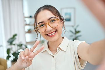 Image showing Woman, smile in selfie with peace hand sign, emoji and social media influencer with post or live streaming. Young female person, gen z and happy posing in picture, memory and content creation