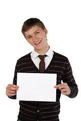 Image showing Young man holding a sheet of paper