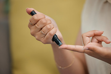 Image showing Hands, woman and blood sugar pen for diabetes in healthcare, medical testing or diabetic medicine. Closeup of person poke fingers with needle to check insulin, monitor glucose and glucometer results