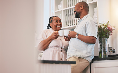 Image showing Coffee, happy and a talking black couple in the kitchen, laughing and relax in the morning. Smile, love and an elderly African man and woman speaking with a tea drink and conversation in a house
