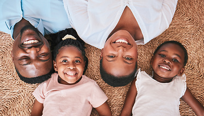 Image showing Above, parents or portrait of happy kids on floor in house or home bonding or playing as a black family. Faces, mother or African father relaxing with kids, girls or siblings with smile, care or love
