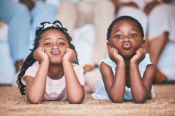 Image showing Relax, girls or portrait of children on the floor, carpet or mat bonding or playing in family home together. Kiss, kids or young African girl siblings resting, playing or enjoying weekend or holiday