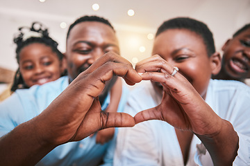 Image showing Hands in heart, family and parent with children in home with gesture for love, support and care. Emoji, happy kids and closeup of African mom and dad with shape for bonding and healthy relationship