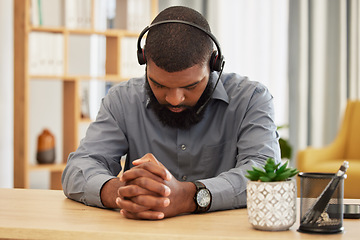 Image showing Call center, stress and black man praying in office for workload, relief or mistake at desk. Telemarketing, fail and guy consultant pray for help with depression, anxiety or customer service pressure