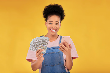 Image showing Phone, money and winner with portrait of black woman in studio for success, prize or online payment. Bonus, lottery and fintech with person and cash on yellow background for dollar, sale or giveaway