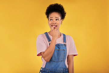 Image showing Question, thinking and woman with anxiety, nervous and decision against a yellow studio background. Female person, why and model confused, anxious and biting nails with depression, stress and fear