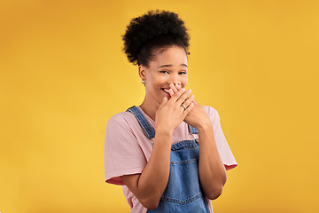 Image showing Laughing, funny and portrait of woman with wow reaction to news isolated in a yellow studio background. Comedy, comic and happy young female person covering mouth due to crazy gossip energy or meme