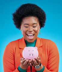 Image showing Woman, piggy bank and wow for savings, financial investment and profit, increase or budget success. Excited african person with banking goals, finance safe and container on a blue, studio background