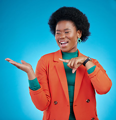 Image showing Hand, presentation and business woman with offer, choice and information for fashion, sale or opportunity. Happy african person or model pointing to palm, decision or design on blue studio background