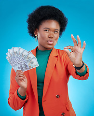 Image showing Money, okay sign and woman thinking of success, profit and sales deal with yes emoji on blue background. Financial ideas of rich, african person for cash, lottery goals or bonus achievement in studio