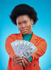 Image showing Money, fan and business woman in portrait for winning, cash and lottery offer on blue background. Face, investment and rich african person or winner with bonus, cashback and financial loan in studio