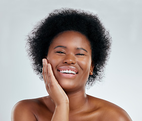 Image showing Happy black woman, portrait and afro in skincare, natural beauty or cosmetics against a white studio background. Face of excited African female person smile for perfect skin, spa or facial treatment