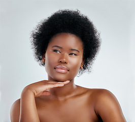 Image showing Face, beauty and skincare of black woman, serious and isolated in studio on white background. Confident, hand or natural African model with cosmetic, facial treatment or aesthetic, wellness or health