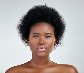 Image showing Face, skincare and beauty of black woman in studio isolated on a white background. Portrait, serious and natural African model with cosmetics, spa facial treatment and aesthetic, wellness or health