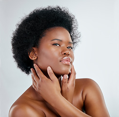 Image showing Beauty, afro and black woman in portrait with skincare or cosmetics in studio background. Dermatology, hand and face african girl with natural hair for treatment with shine for wellness in mock up.