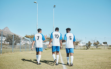 Image showing Soccer, team and walking on field with back or conversation at training or competition in out with grass. Fitness, teamwork and stadium with football player after game or collaboration at club.