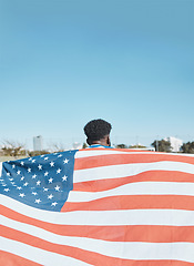 Image showing American flag, back and sports man with mockup space on blue sky outdoor. Usa banner, national and athlete with patriotism, pride or representation to support country, motivation and independence day