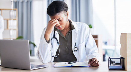 Image showing Headache, tired doctor and woman in medical office with burnout challenge, clinic problem and stress risk. Frustrated black female healthcare worker with fatigue, migraine pain and anxiety of mistake