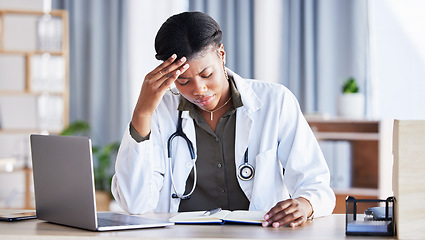 Image showing Doctor, African woman and headache with laptop at desk, clinic office or stress with thinking at job. Overworked medic, fatigue and burnout in hospital, book or anxiety for mental health by computer