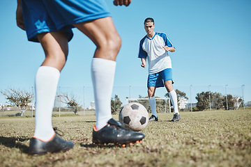 Image showing Football player, ball and game on field for team competition, game or match training, exercise and strategy. Goal, action and young people or men with soccer or legs cardio on sports pitch or ground