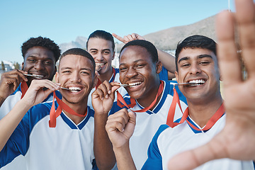 Image showing Men in selfie, medal and winner, soccer competition and sports, athlete group on field, diversity and success. Portrait, young male football player and team with smile in picture, winning and prize