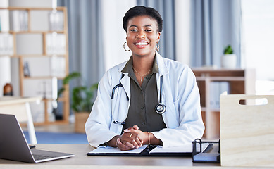 Image showing Black woman, portrait and doctor in office for medical services, advice and consulting in clinic. Happy female therapist, healthcare worker and consultant at desk in hospital for wellness management