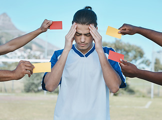 Image showing Hands, card and man with stress from soccer, training headache and warning on the field. Sports, burnout and frustrated athlete with anxiety during a football game with a red and yellow referee fail