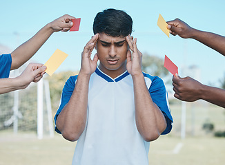Image showing Hands, card and a man with headache from soccer, fitness stress and warning on the field. Sports, burnout and a frustrated athlete with anxiety during a football game with a referee fail or problem